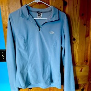Light blue North Face fleece only worn a few times. Large but fits like a medium